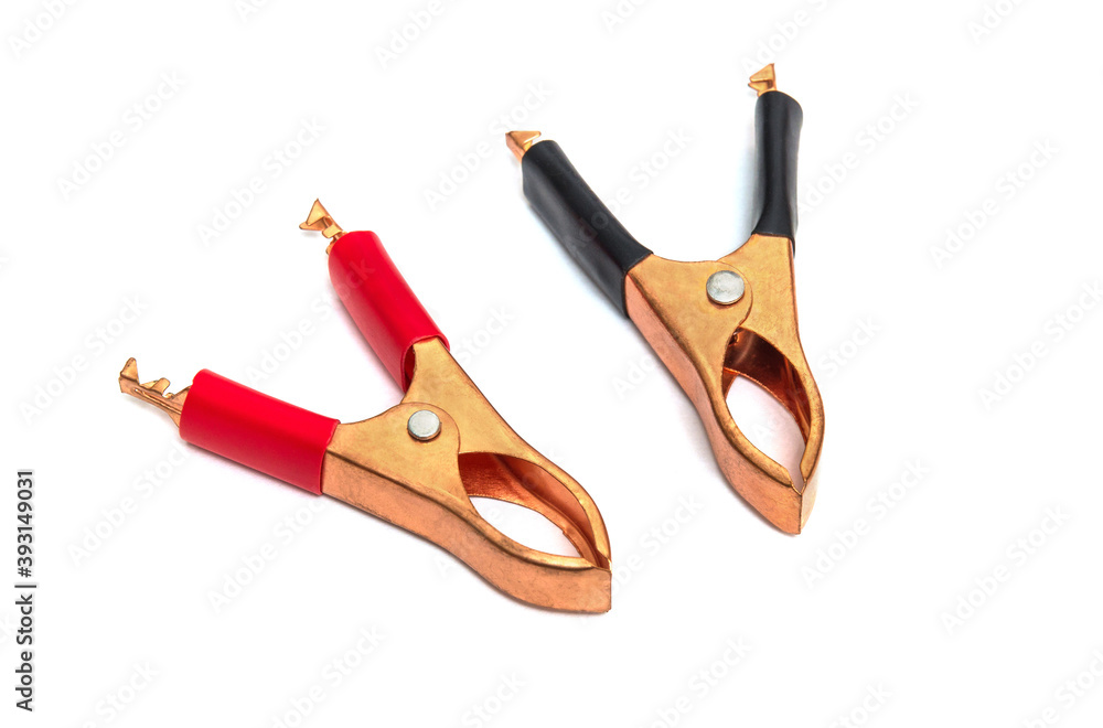 Copper crocodile clip black and red for wires on white background Copper crocodile clip black and red for wires on white background
