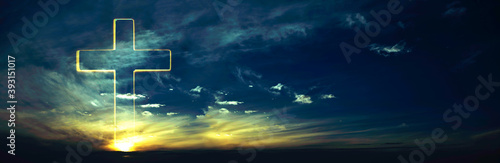 Konstfotografi Silhouette of shining cross on sunset, sunrise background