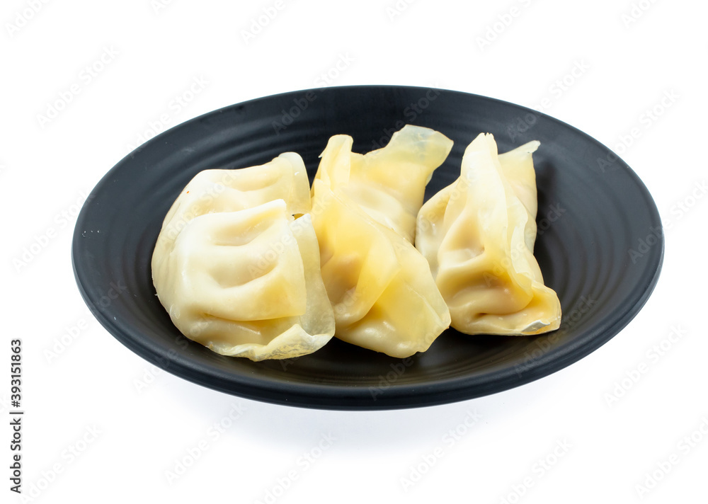 fresh raw Dumpling sliced on square plate isolated on white background, shabu, hot pot ingredients