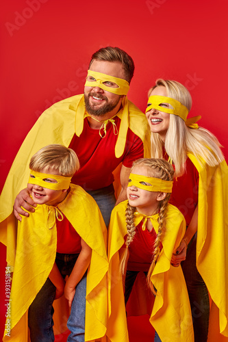 brave parents and children insuperhero costume. family power concept. family pretend being superheroes, hope for success and leadership