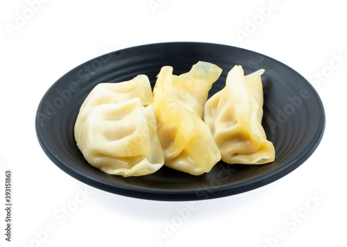 fresh raw Dumpling sliced on square plate isolated on white background, shabu, hot pot ingredients