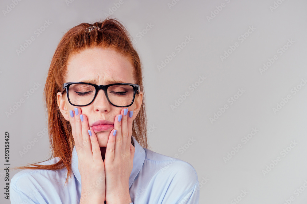 redhair ginger woman touching her cheekbones closed eyes redhair ginger woman touching her cheekbones closed eyes