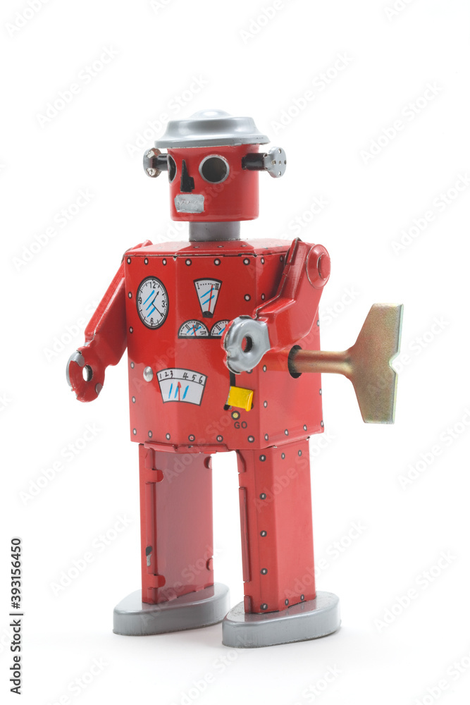 Fototapeta premium Old toy red metal robot on white