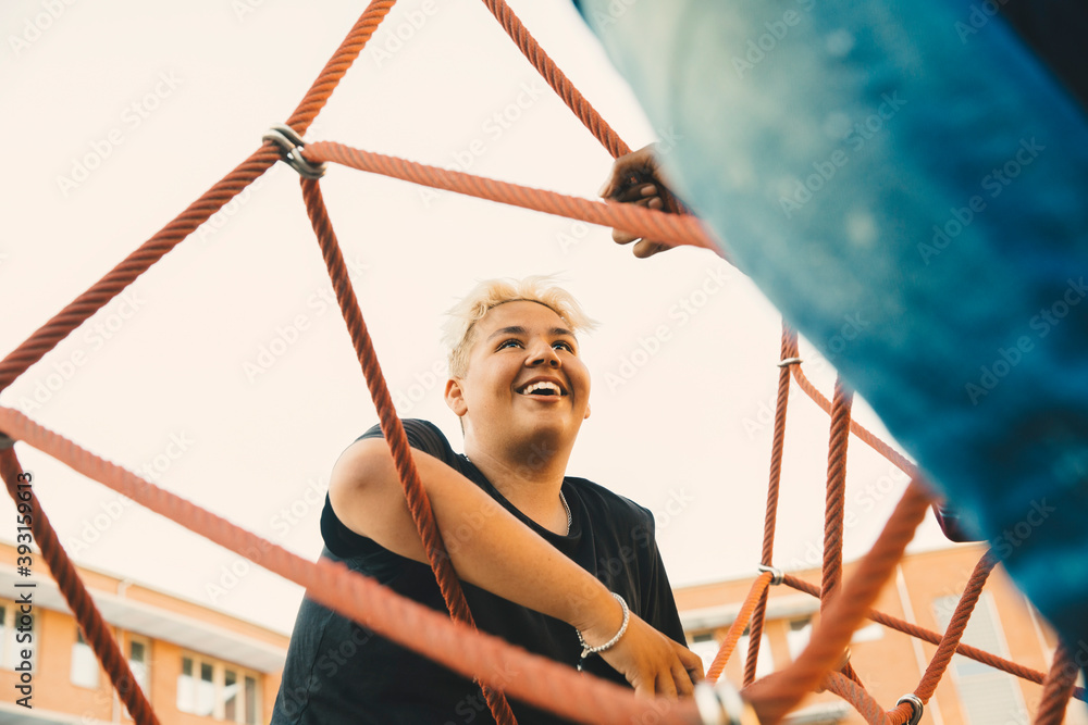 Smiling teenager looking at friend in park Smiling teenager looking at friend in park