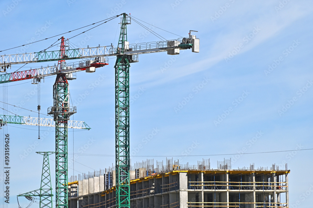 Crane and highrise construction site Crane and highrise construction site