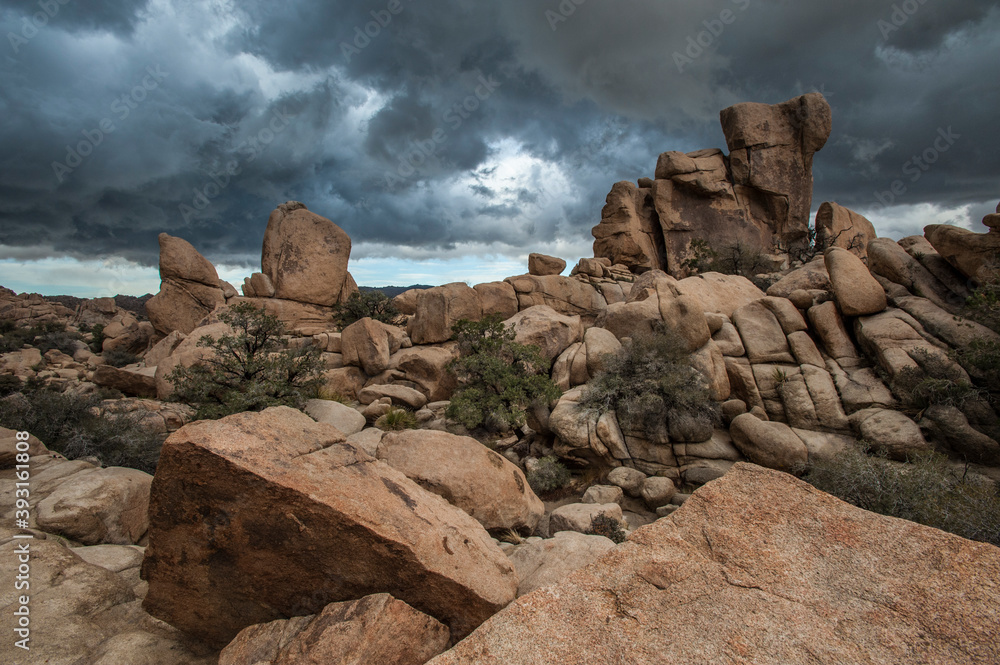 Scenic view of rock formations in Hidden Valley against stormy sky Scenic view of rock formations in Hidden Valley against stormy sky