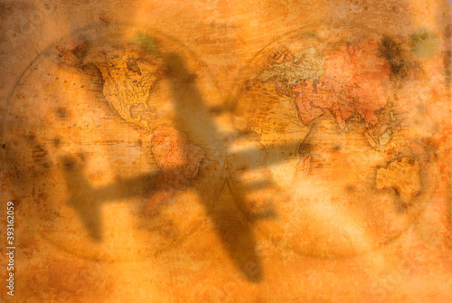 Antique style passenger plane shadow on 19th century world map