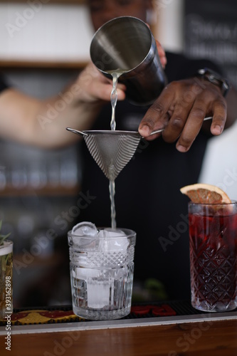 Bartender mixing fresh ice cockteil photo