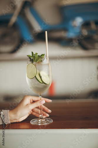 Cockteil with specific cucumber and ice  photo