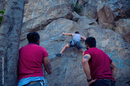 Young man climbing on a limestone wall © @Nailotl