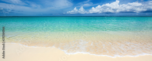 Scenic view of beach against cloudy sky photo