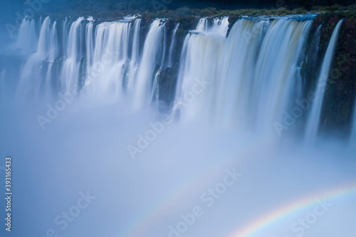 Scenic view of rainbow below Iguazu Falls photo