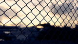 wire fence with sunset