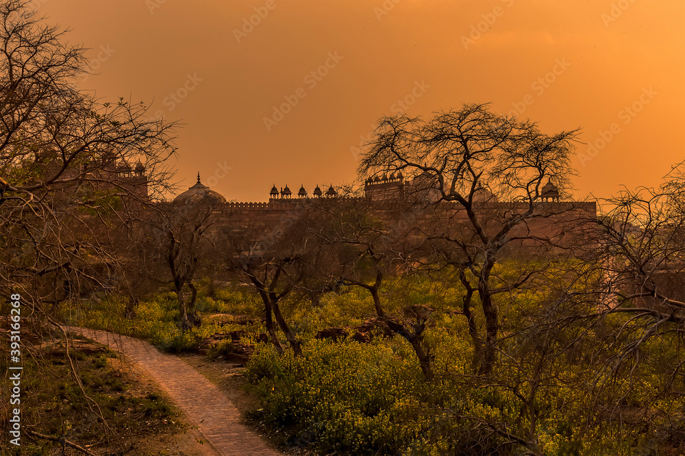 The abandoned temple complex walls at Fathepur Sikri, India glows after sunset The abandoned temple complex walls at Fathepur Sikri, India glows after sunset