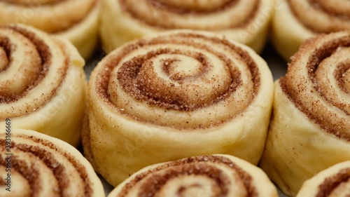 cooking cinnamon rolls or Cinnabon close up. raw cinnamon buns. Production of cinnamon rolls © Евгений Логвиненко