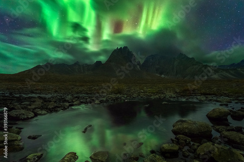 Fotografie Scenic view of Aurora Borealis over Ogilvie Mountains