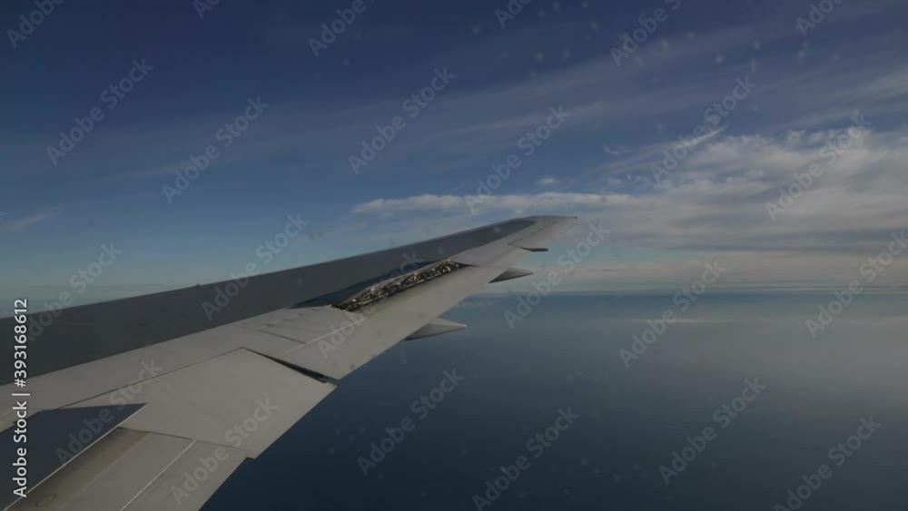 Plane aileron operating over the Atlantic Ocean Plane aileron operating over the Atlantic Ocean