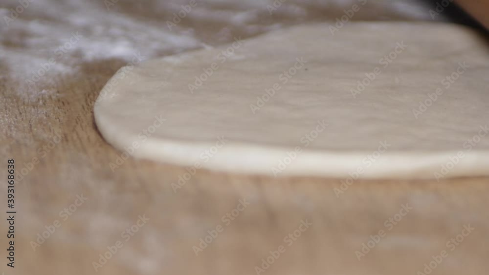 Roll the dough with a dough roll Roll the dough with a dough roll