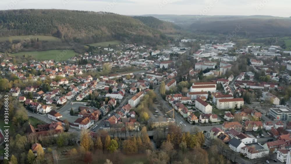 Drone Aerial of the Heilbad Heiligenstadt. This traditional german town is a district town of the Eichsfeld in Thuringia (Germany) and a recognized brine spa. Sunset in late autumn. Drone Aerial of the Heilbad Heiligenstadt. This traditional german town is a district town of the Eichsfeld in Thuringia (Germany) and a recognized brine spa. Sunset in late autumn.