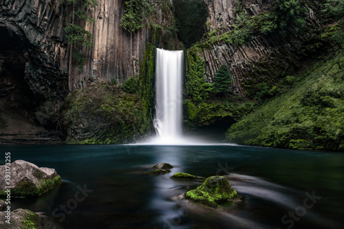 Stunning Toketee Falls in Oregon surrounded by basalt columns and mossy rocks. 