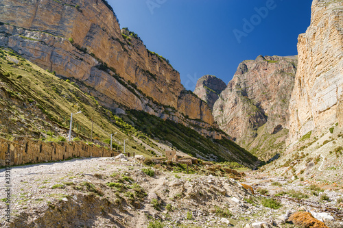 Sunny view of mountains and Eltyulbyu village in North Caucasus, Kabardino-Balkaria, Russia.