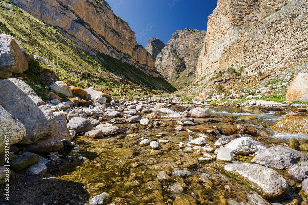 Sunny view of  mountains and Eltyulbyu village in North Caucasus, Kabardino-Balkaria, Russia.