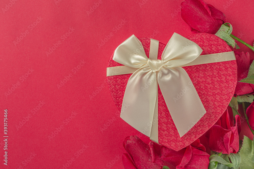 Valentine day Greeting background, heart shaped gift box with red ribbon bow, copy space for your text Valentine day Greeting background, heart shaped gift box with red ribbon bow, copy space for your text