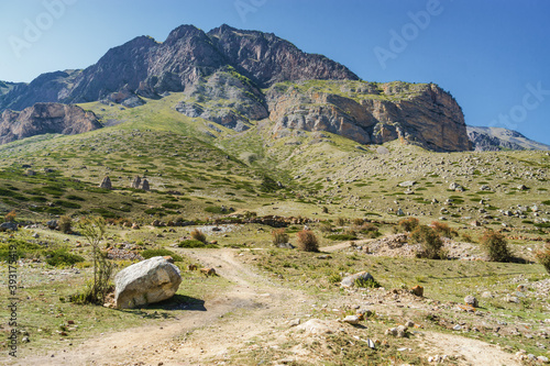 Sunny view of mountains and Eltyulbyu village in North Caucasus, Kabardino-Balkaria, Russia.