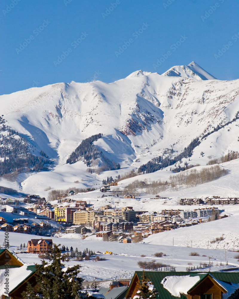 Mt. Crested Butte Perspective - Distant photo of the town of Mt. Crested Butte, Colorado from Crested Butte in winter gives perspective of how large the ski mountain is that surrounds it