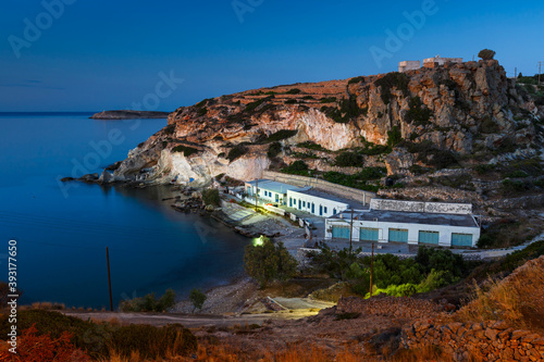 Boat houses in fishing village of Goupa on Kimolos island in Greece. photo