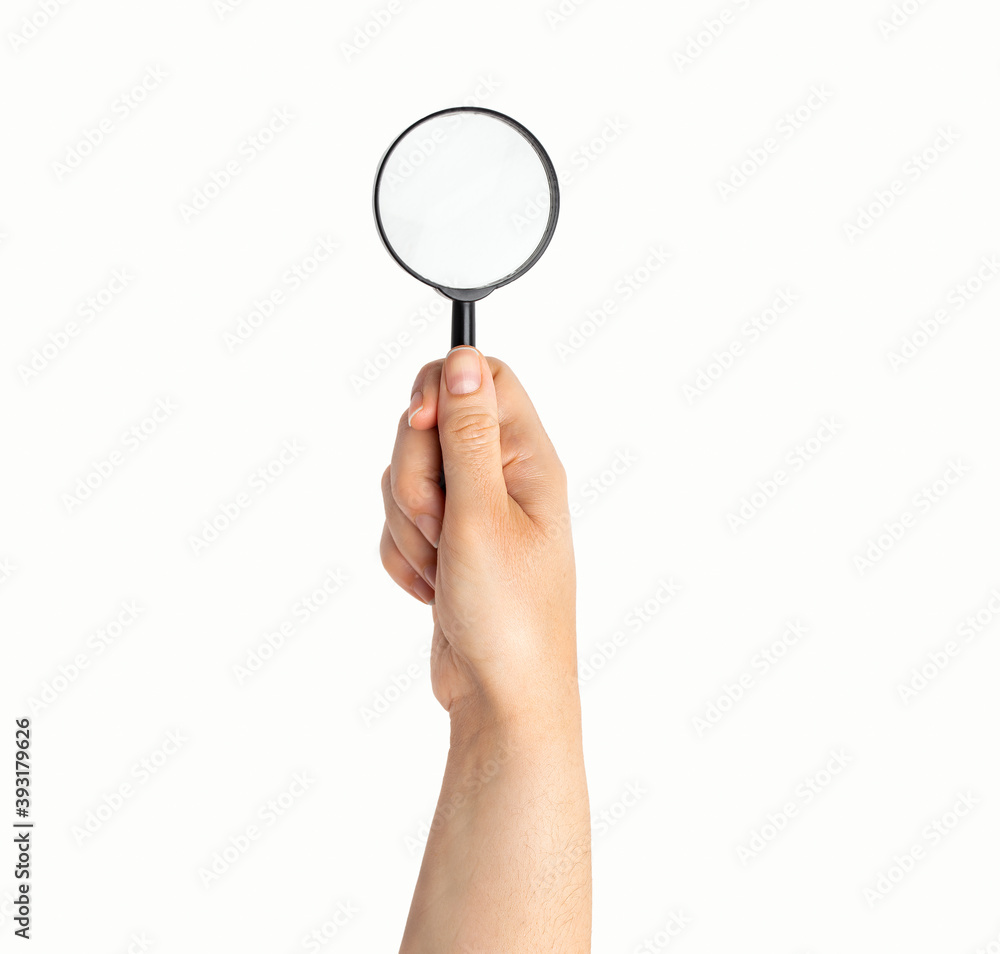 Magnifying glass in hand isolated on white Magnifying glass in hand isolated on white