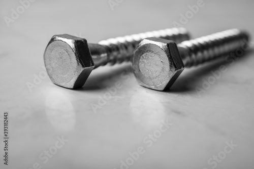 Steel chrome screw equipment, construction tools background.