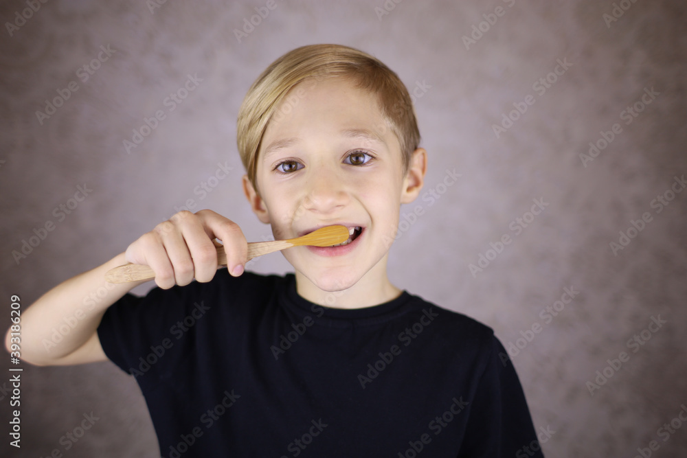boy brushes his teeth with eco brush made of natural material boy brushes his teeth with eco brush made of natural material