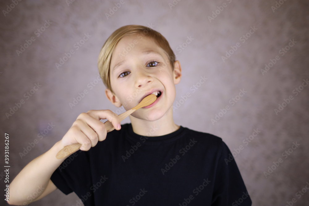 boy brushes his teeth with eco brush made of natural material boy brushes his teeth with eco brush made of natural material