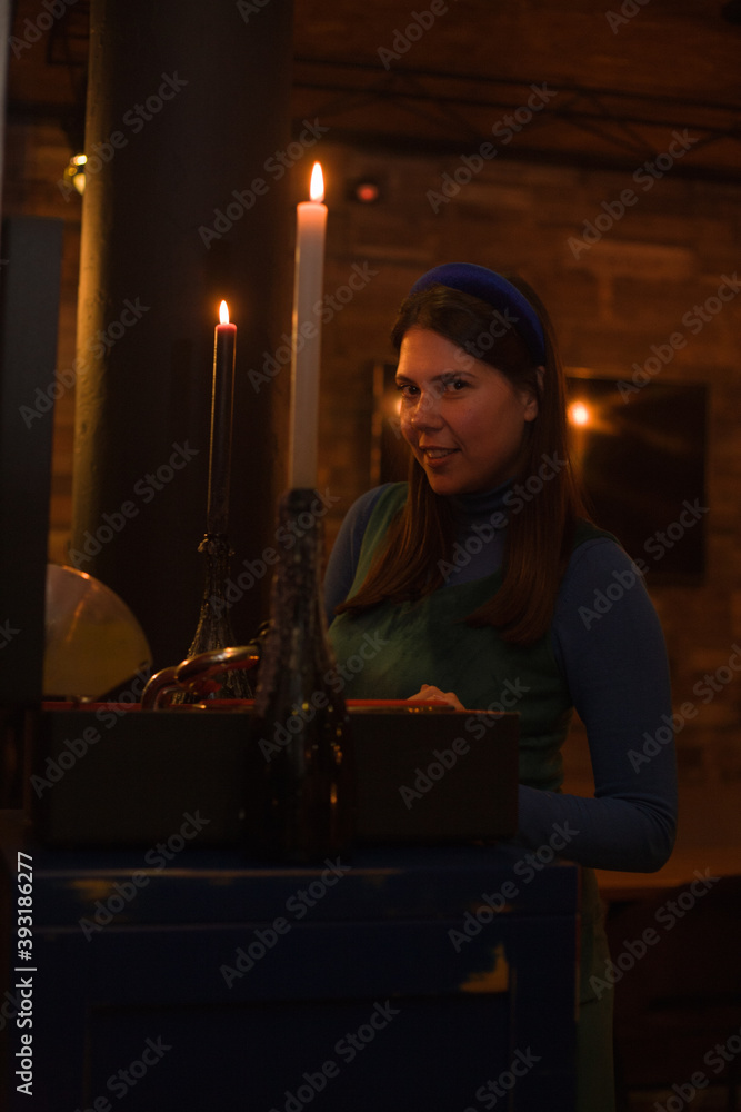 woman with candle in the cafe woman with candle in the cafe