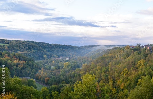 View from Rothenburg ob der Tauber in autumn with colorful trees. Bavaria, Bayern, Germany.