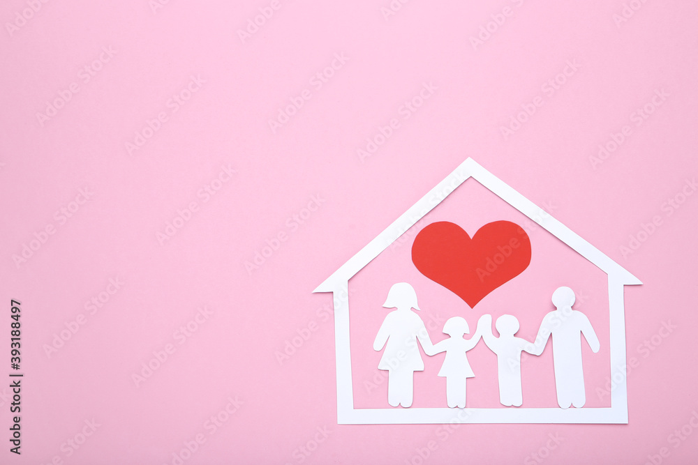 Family and house figures with red heart on pink background Family and house figures with red heart on pink background
