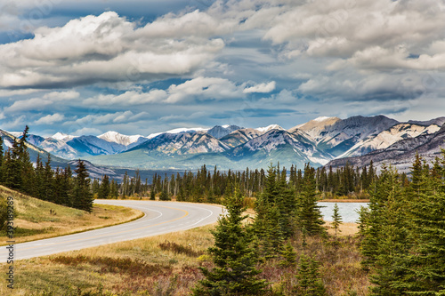 The road to distant snow-capped mountains