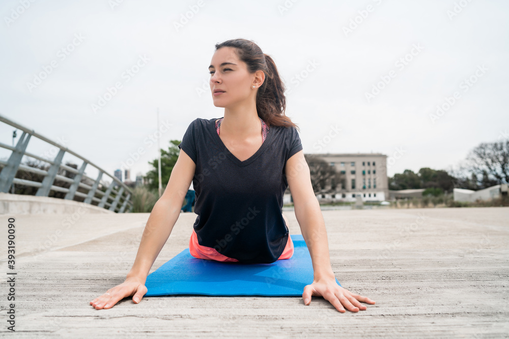 Athletic woman doing exercise with yoga mat. Athletic woman doing exercise with yoga mat.