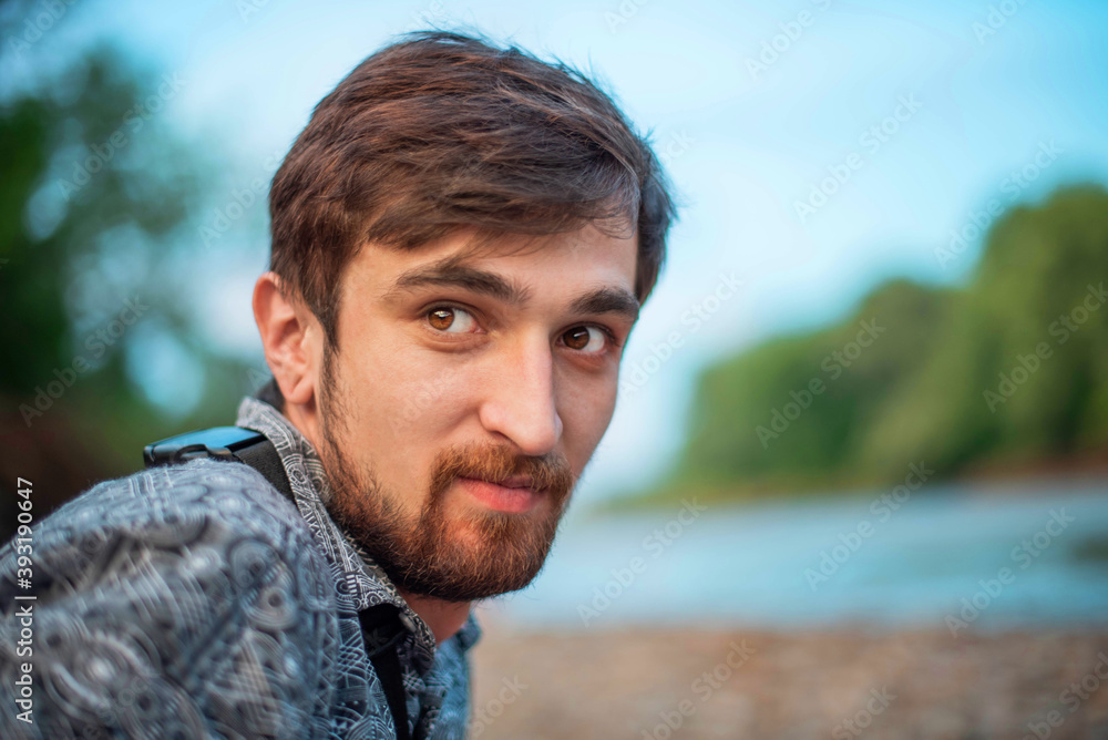 Close up portrait of informal boy/man om natural background Close up portrait of informal boy/man om natural background
