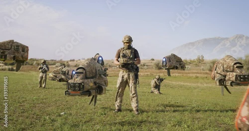 Military man launching drones in field