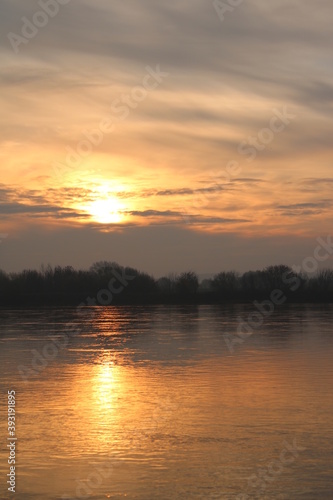 Beautiful sunrise on the Vistula River, Chelmno, Poland, reflection in water. © Krzysztof Furmaga