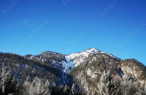 snow covered mountains and blue sky in winter