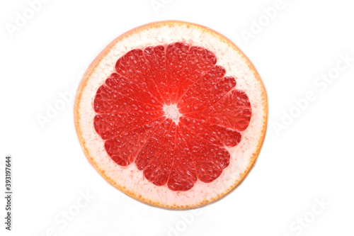 Close up of grapefruit slice on white background