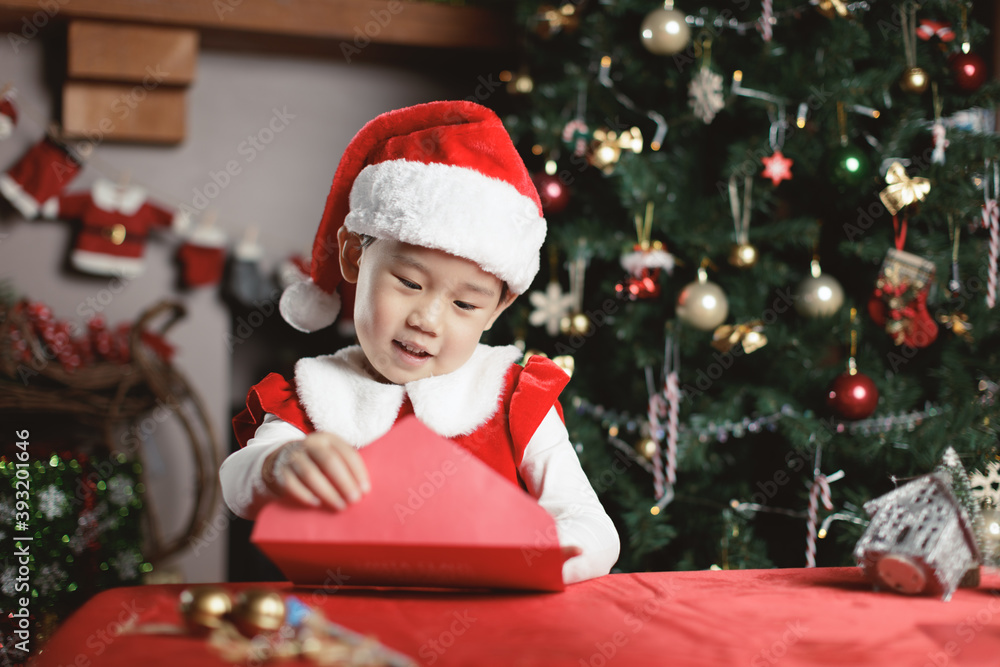 young girl  was writing letter to santa at home