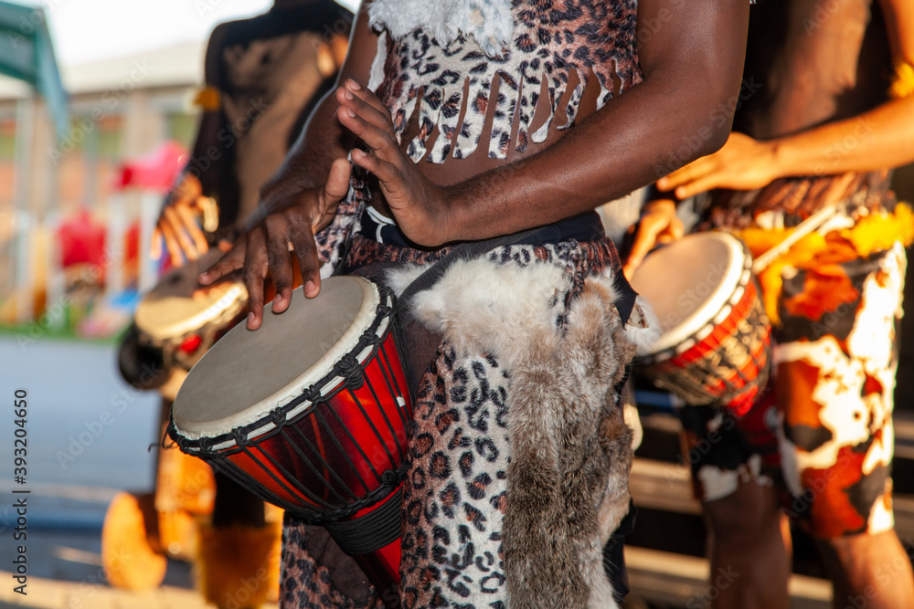 An African drummer plays the djembe.