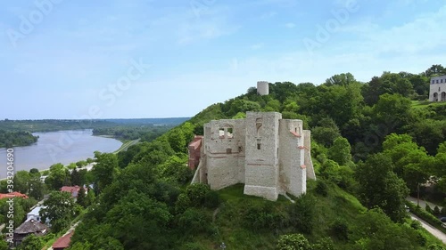 Aerial view of old castle on green hill. Drone aerial view.