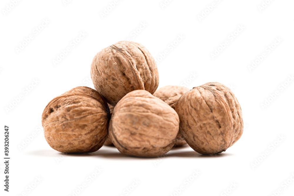Walnuts in shell isolated on a white background Walnuts in shell isolated on a white background