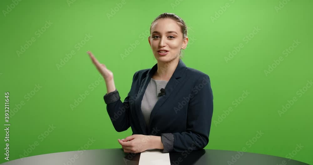 Professional female journalist talking into a camera and expressively gesturing. Beautiful woman presenting a product in commercial. Shot on green background 4k footage Professional female journalist talking into a camera and expressively gesturing. Beautiful woman presenting a product in commercial. Shot on green background 4k footage