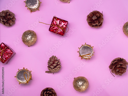 Christmas decorations on a pink background. new year and Christmas toys